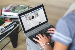 Woman with facebook on her laptop for inbound marketing