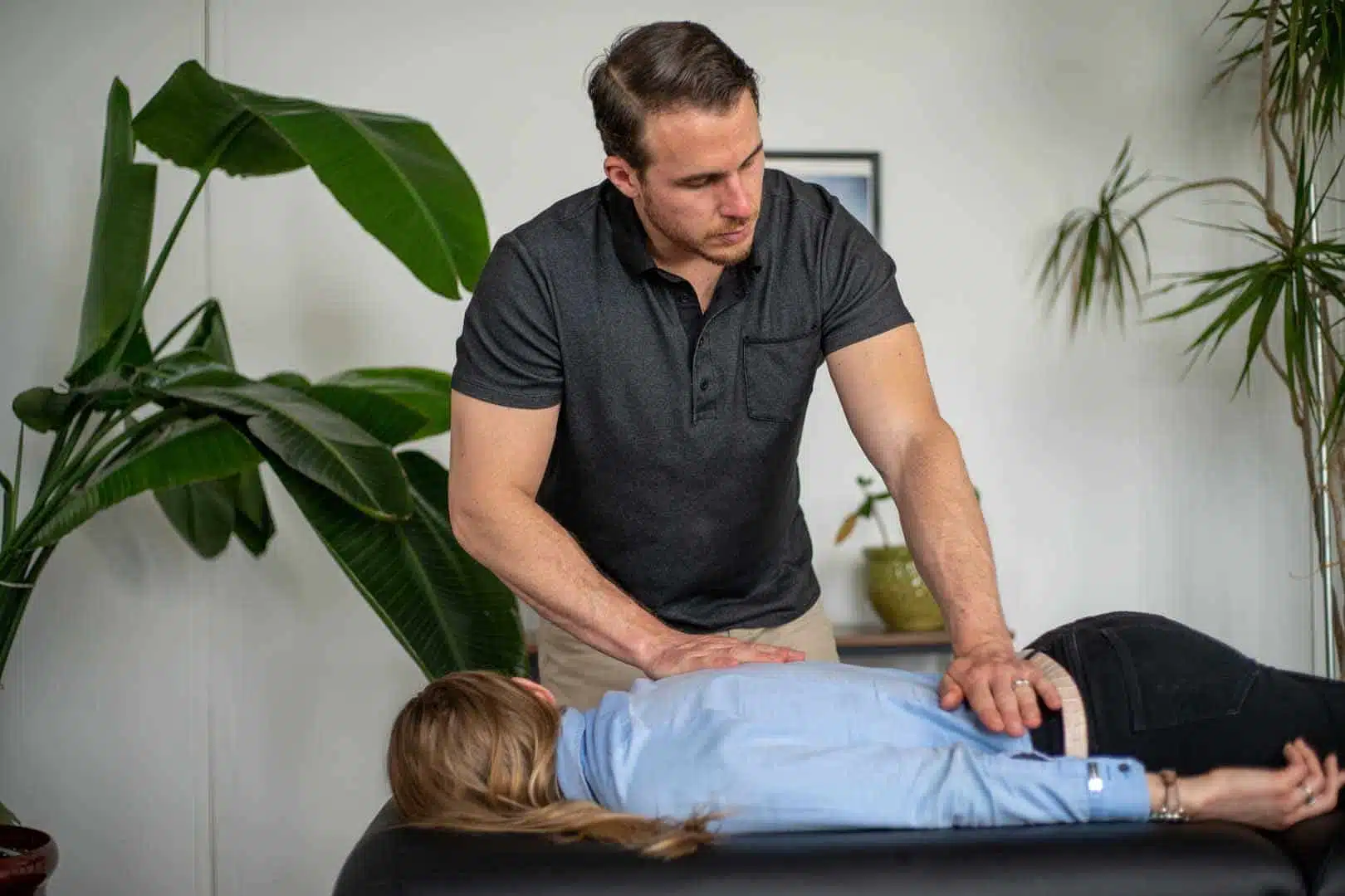 A Chiropractor Perform an Adjustment to his patient