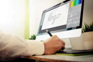 Designer designing a logo on his computer