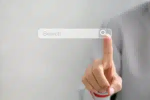 Woman pointing out the search bar on a virtual screen concept