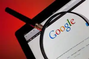 Google in a tablet with a magnifying glass