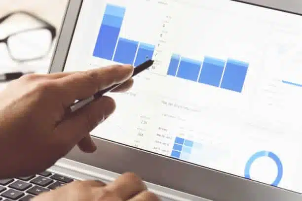 Digital marketer tracking the metrics report.