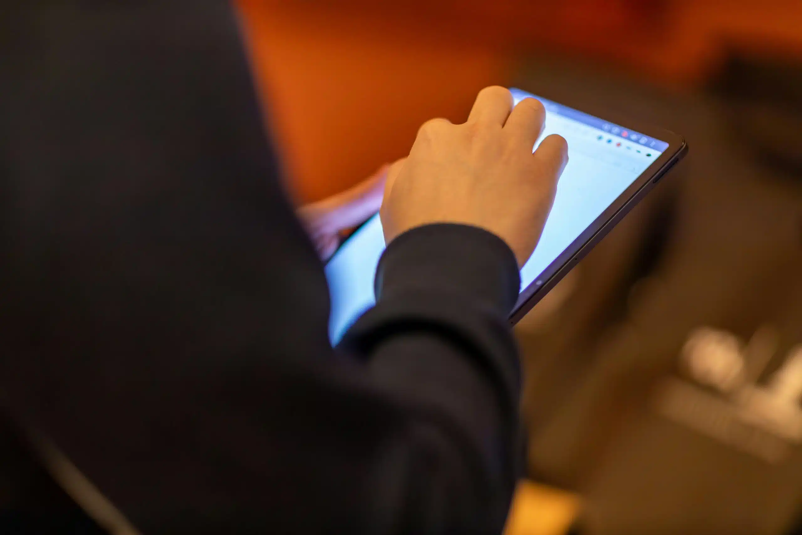 man holding a tablet accessing websites