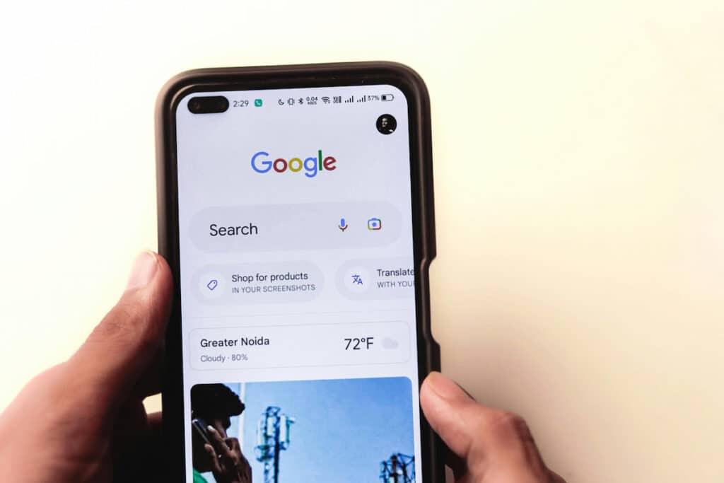 Men typing in the Google search engine from realme 6 pro. Google is the number one search web.